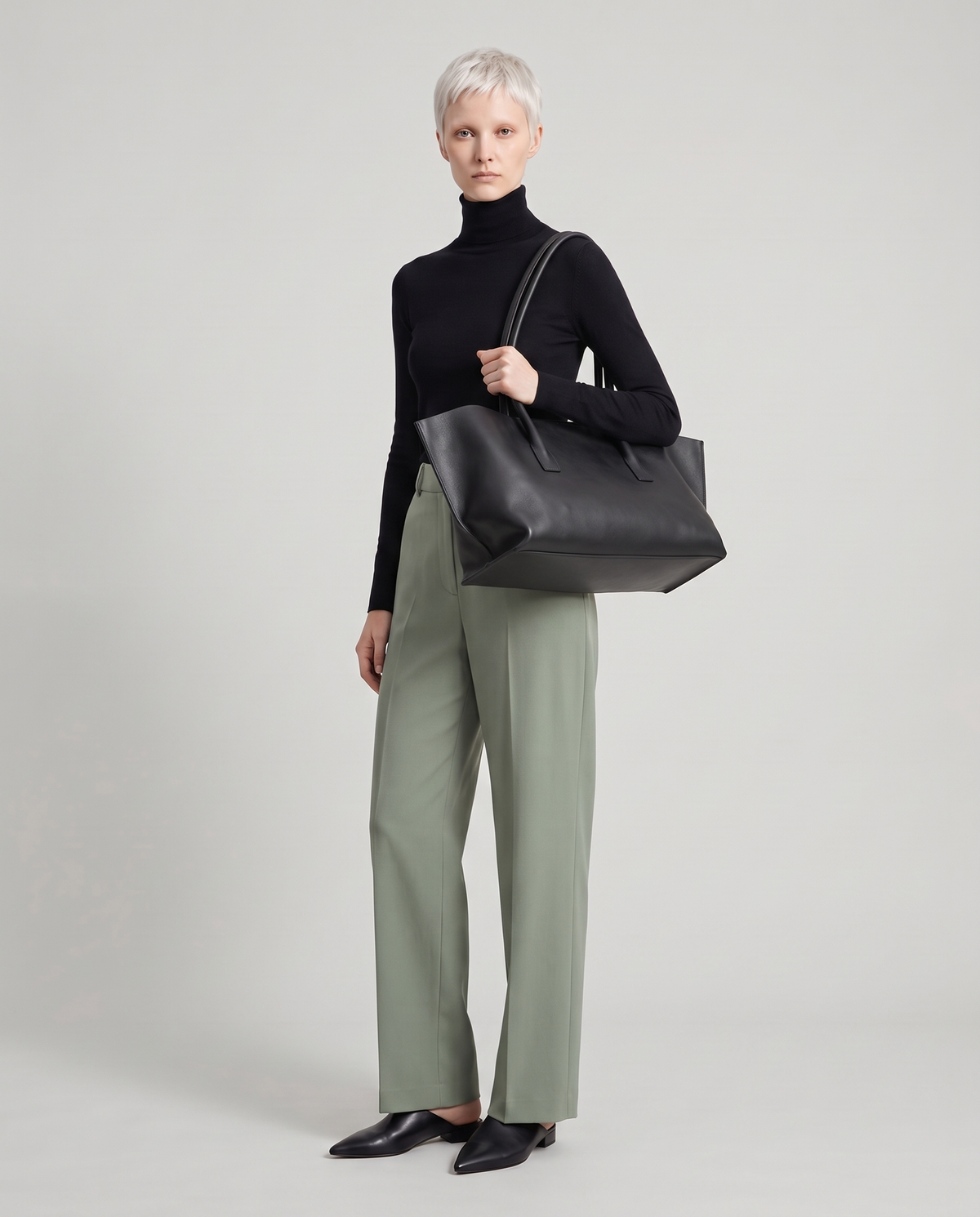 Model with the Gaia leather tote in black, full length