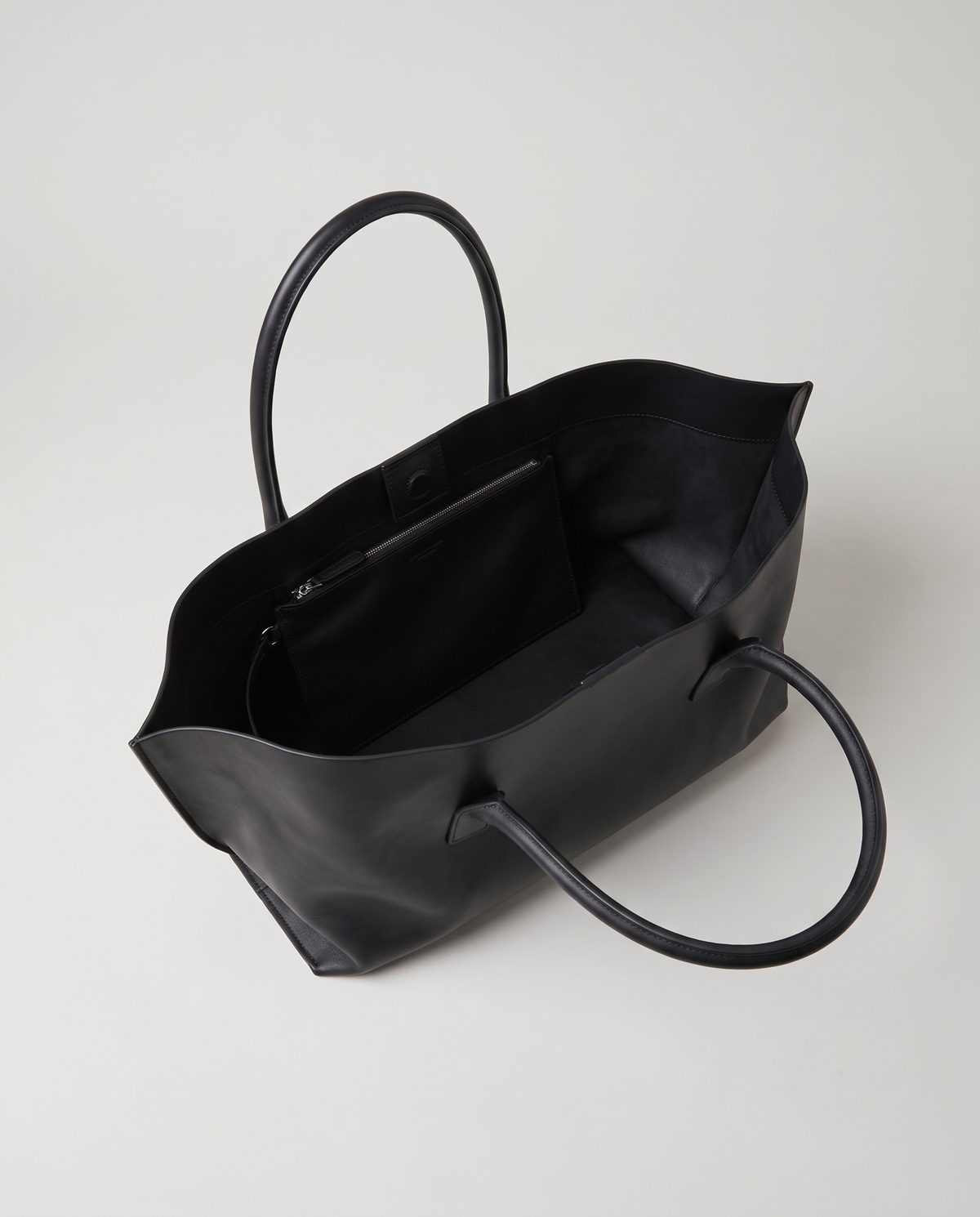Gaia leather tote in black, open showing interior