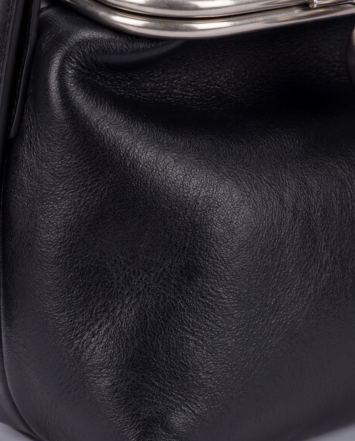 Close-up of the soft cowhide leather on the Garda bag in Black
