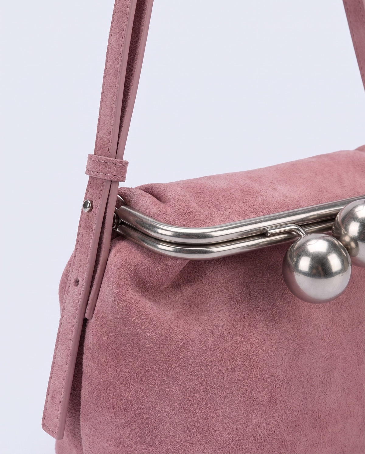 Close-up of the suede cowhide on the Garda bag in Rose