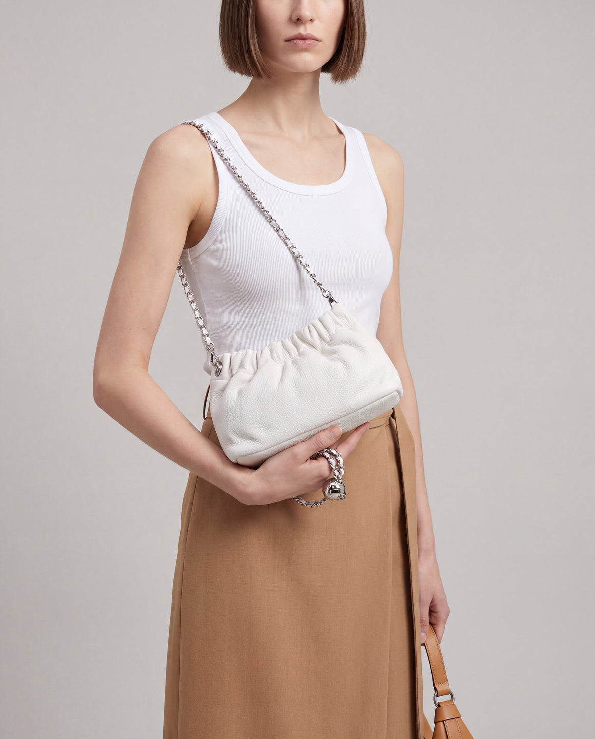 Giro bag in White – worn by model, close-up