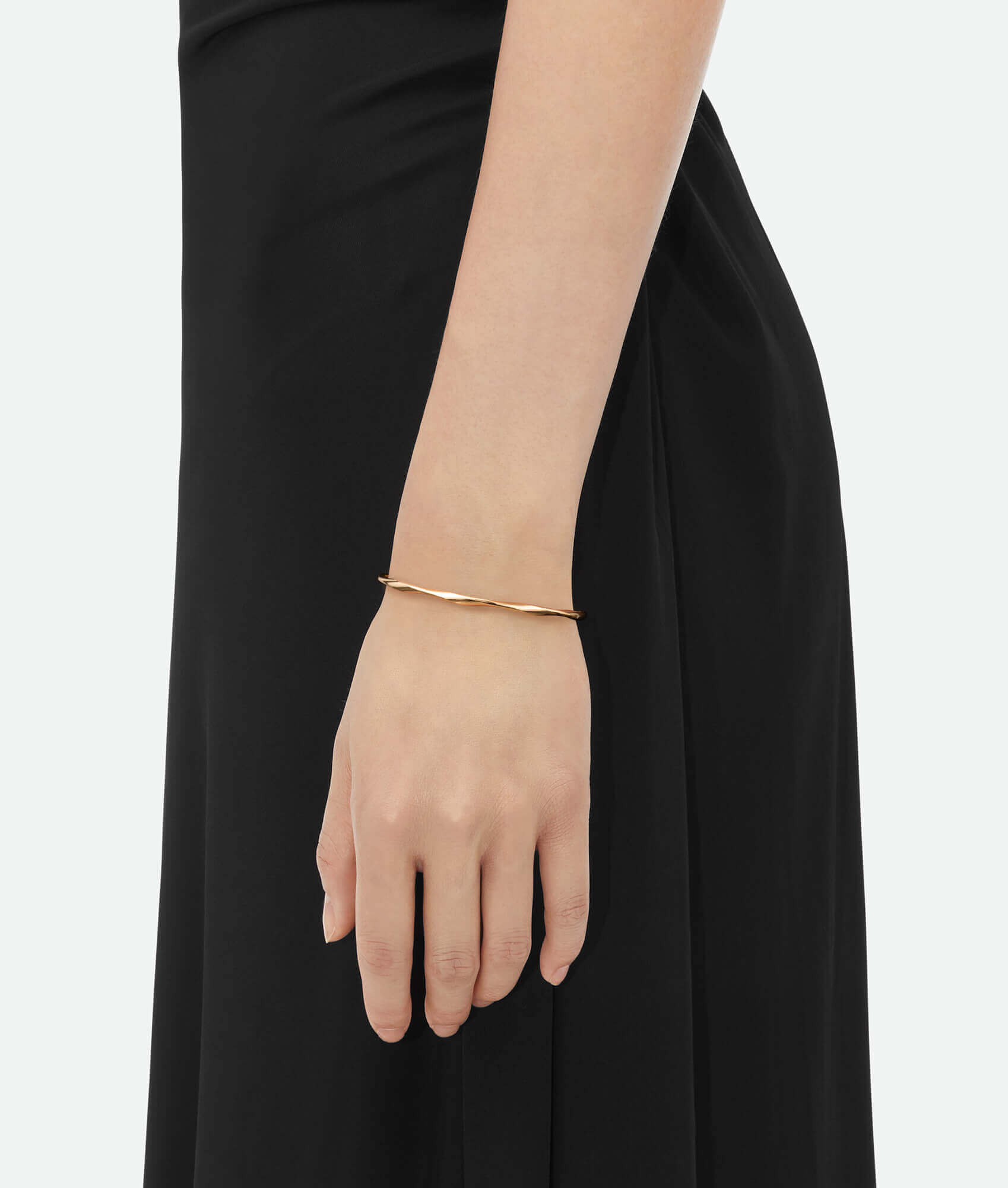 A model wearing a Gold cuff bracelet