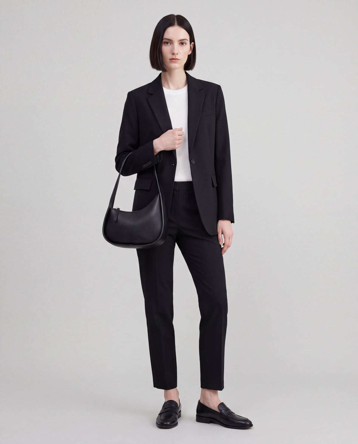 Muse bag in Black – worn by model, full length