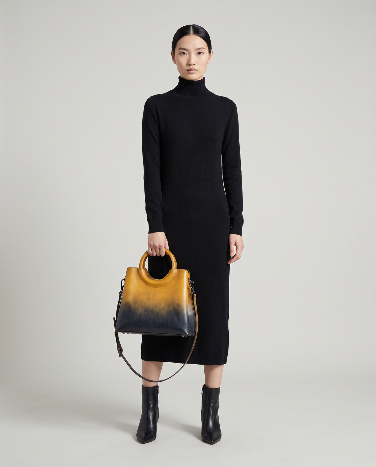 Ombra hand-painted ombré leather bag in Yellow – model holding it by the ring handles, full length