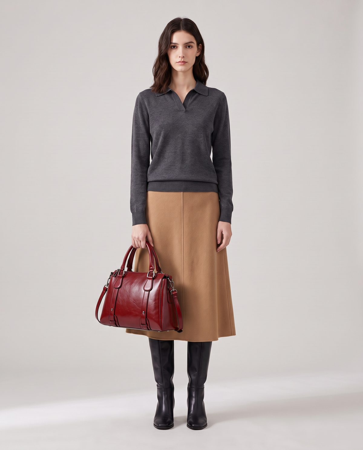 Harlow leather handbag in Red – model holding it by the top handles, full length