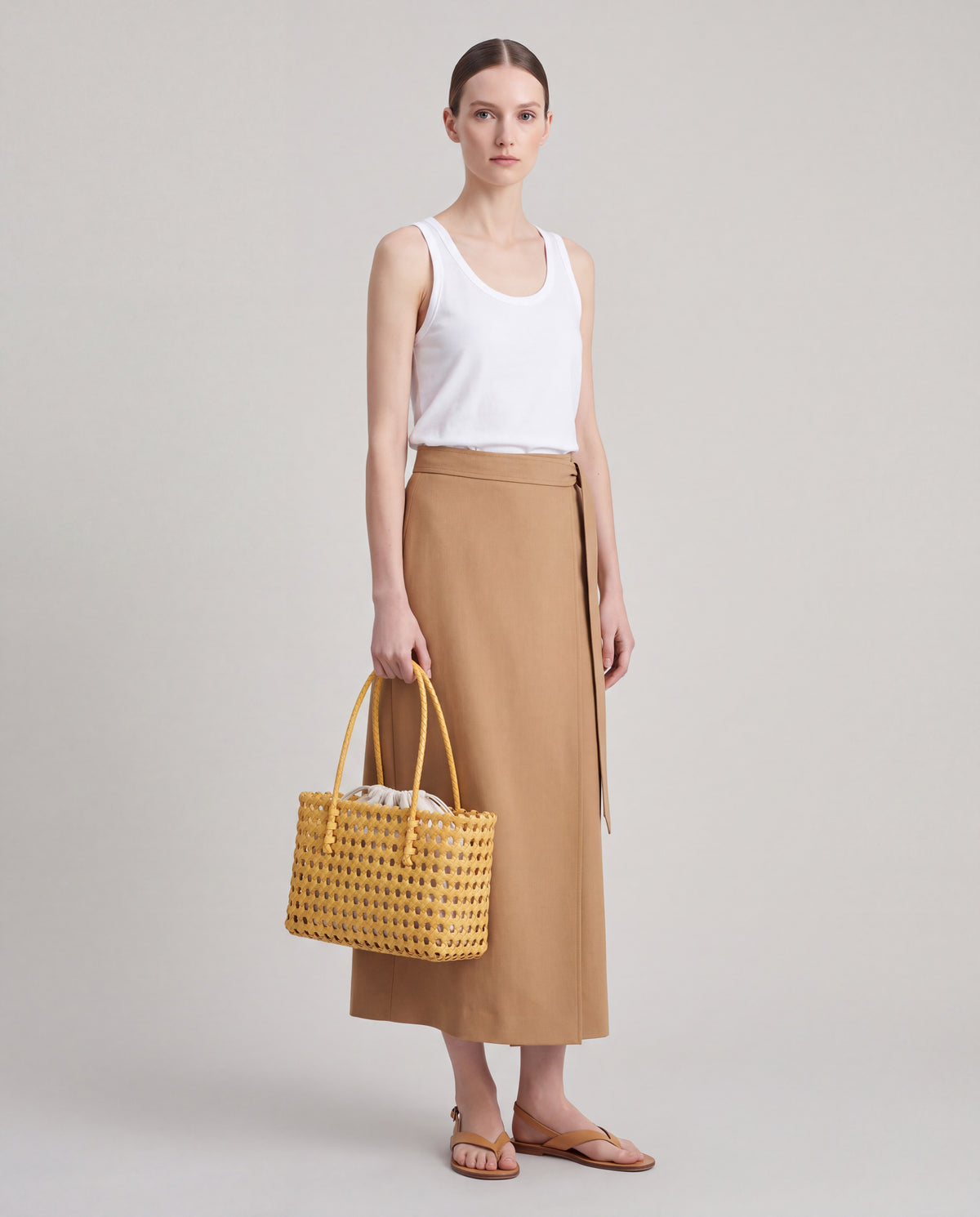 Lattice bag in Yellow – worn by model, full length