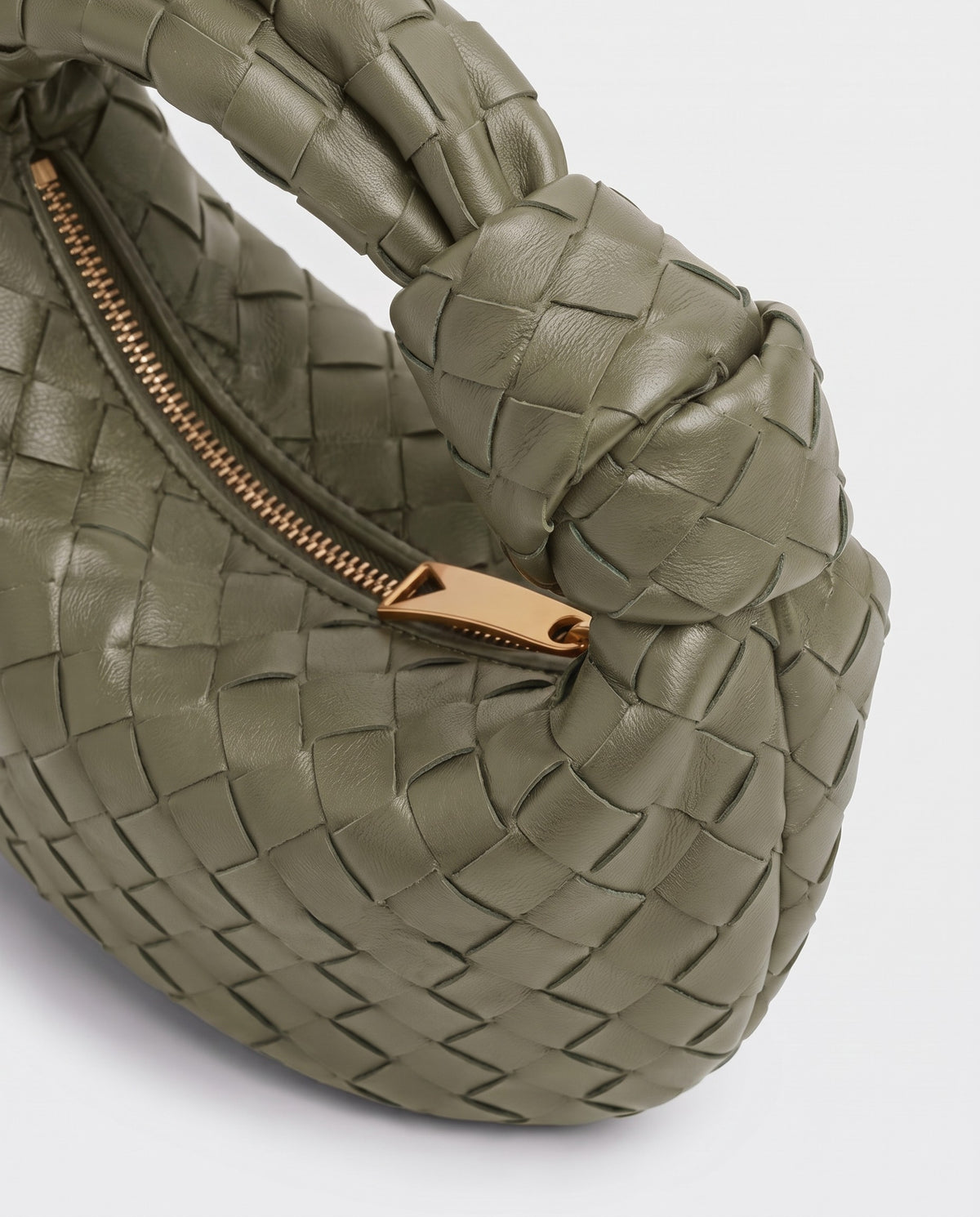 Knot Midi woven leather bag in Sage – close-up of the knotted handle