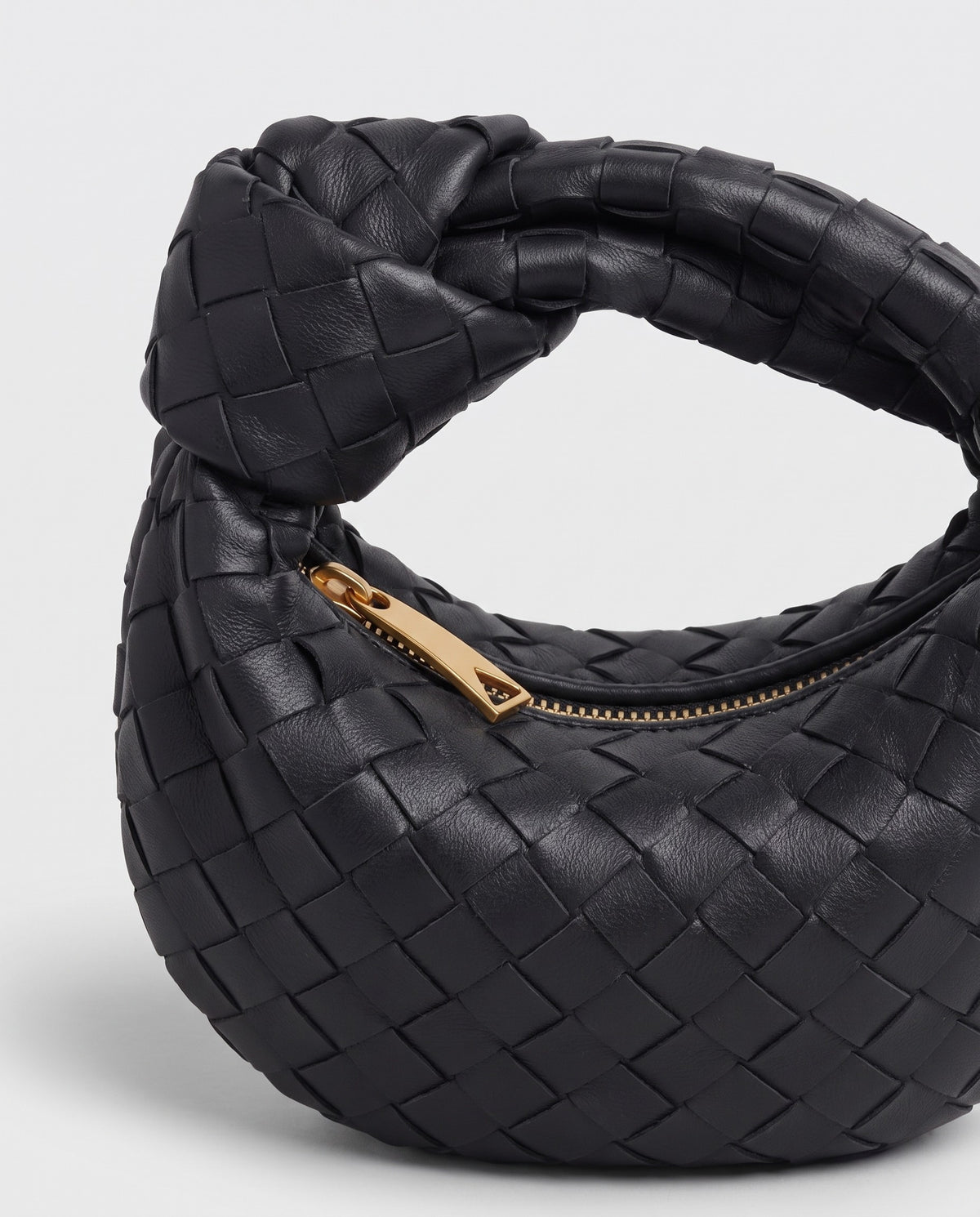 Knot Mini woven leather bag in Black – close-up of the knotted handle
