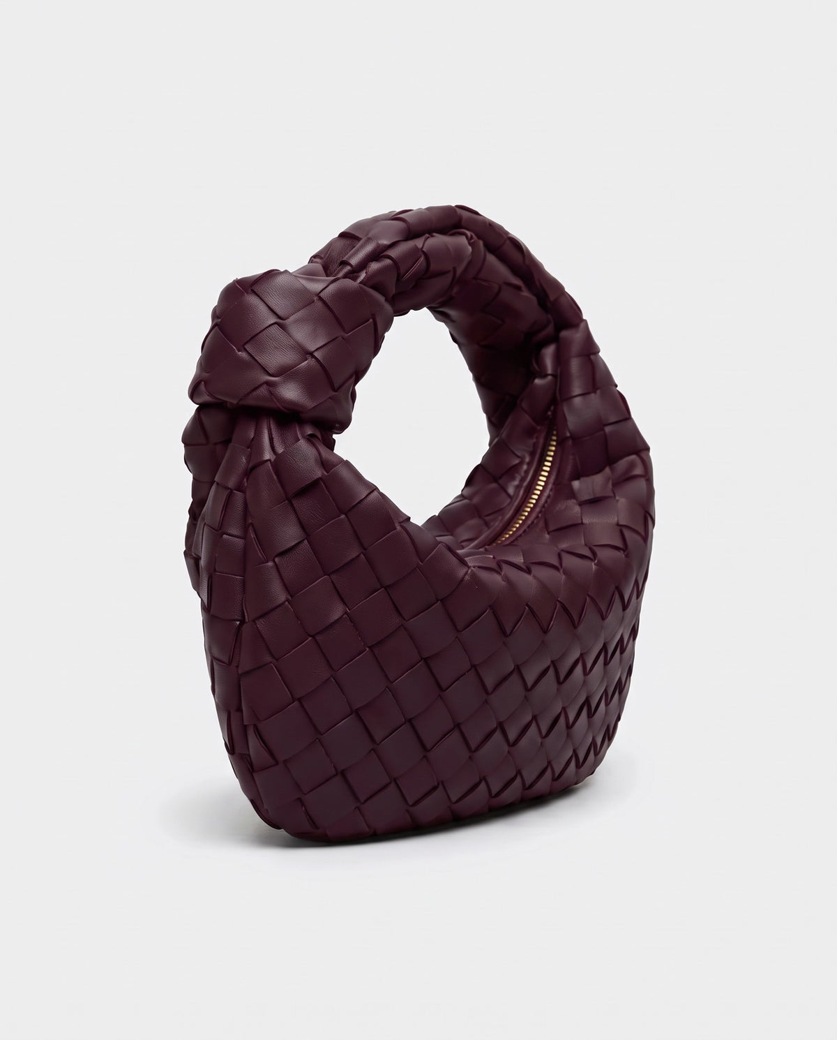 Knot Mini woven leather bag in Bordeaux – three-quarter view