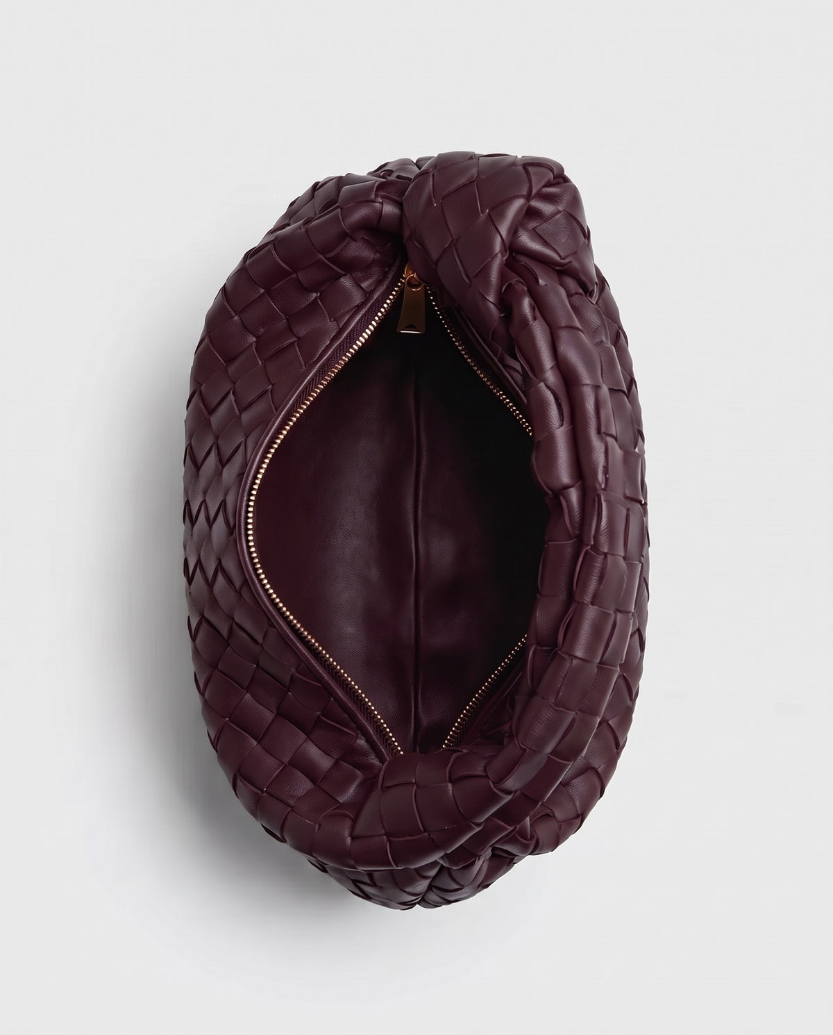Knot Mini woven leather bag in Bordeaux – inside view with the zip open
