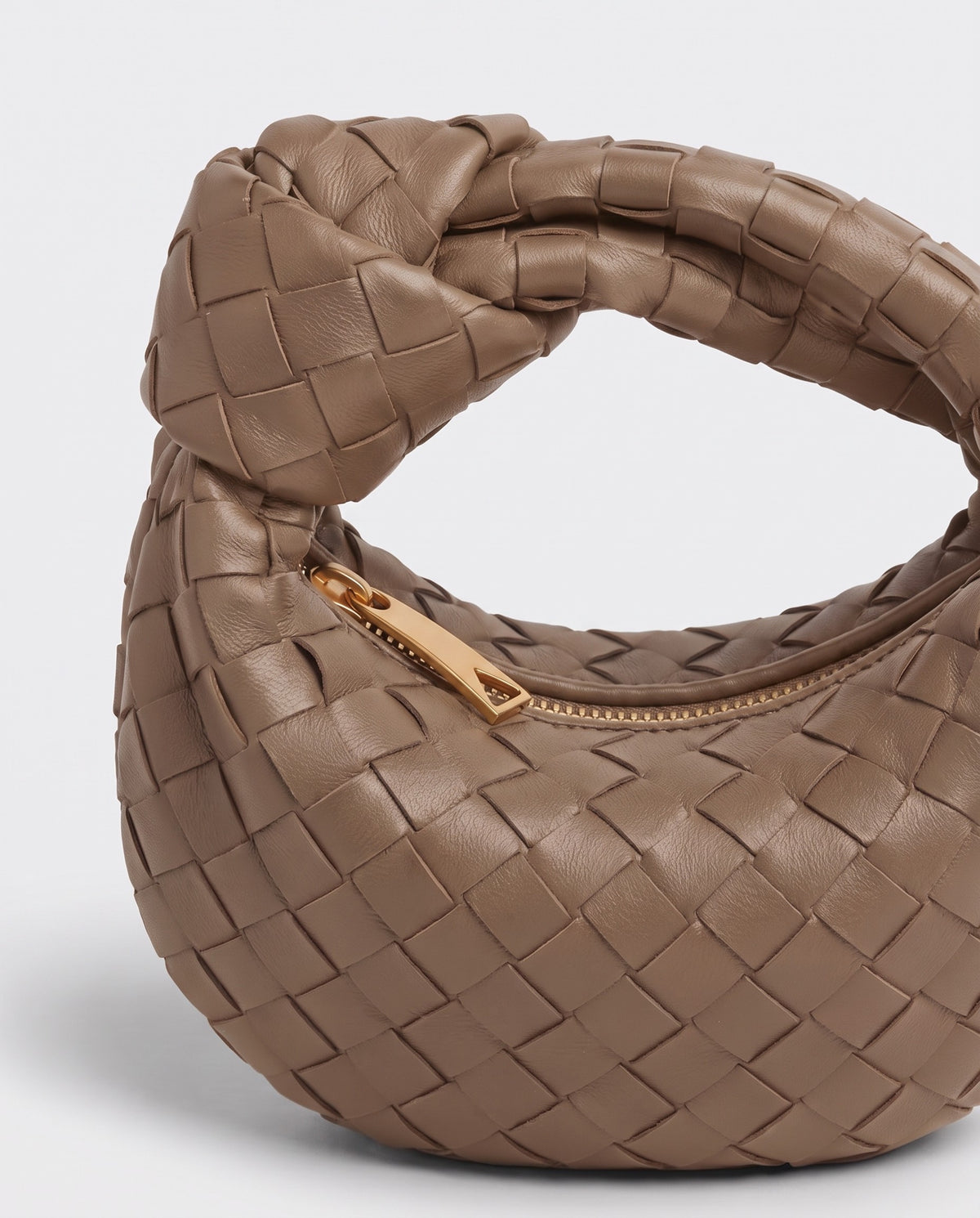 Knot Mini woven leather bag in Camel – close-up of the knotted handle