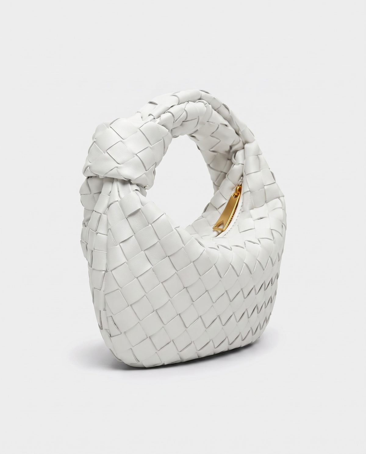 Knot Mini woven leather bag in Chalk – three-quarter view