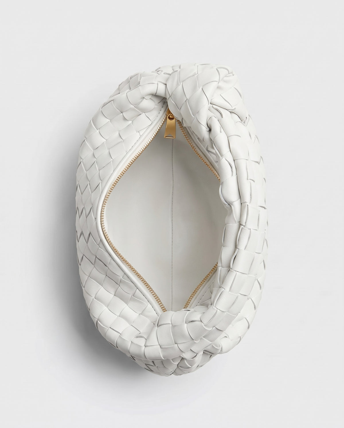 Knot Mini woven leather bag in Chalk – inside view with the zip open