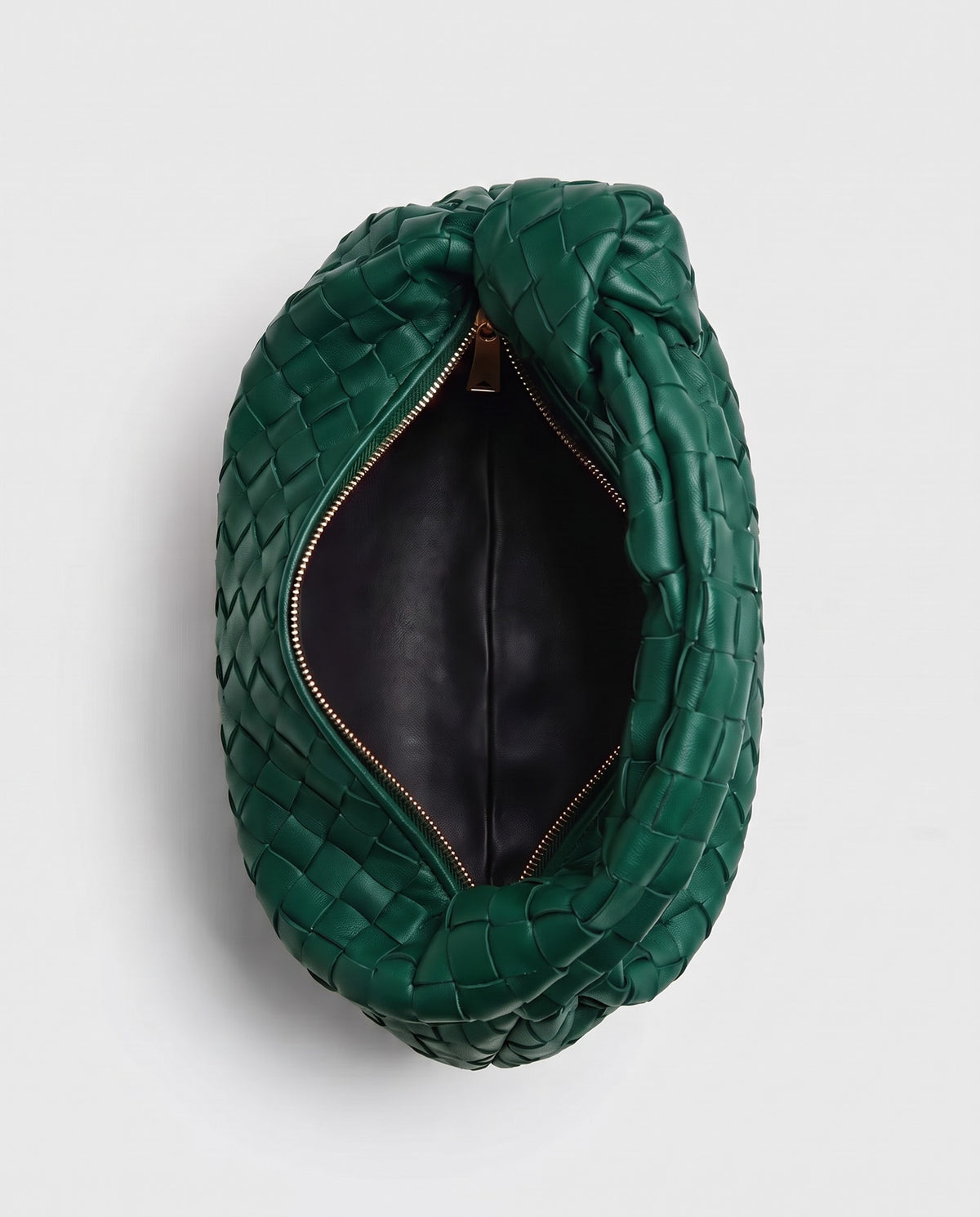 Knot Mini woven leather bag in Emerald – inside view with the zip open