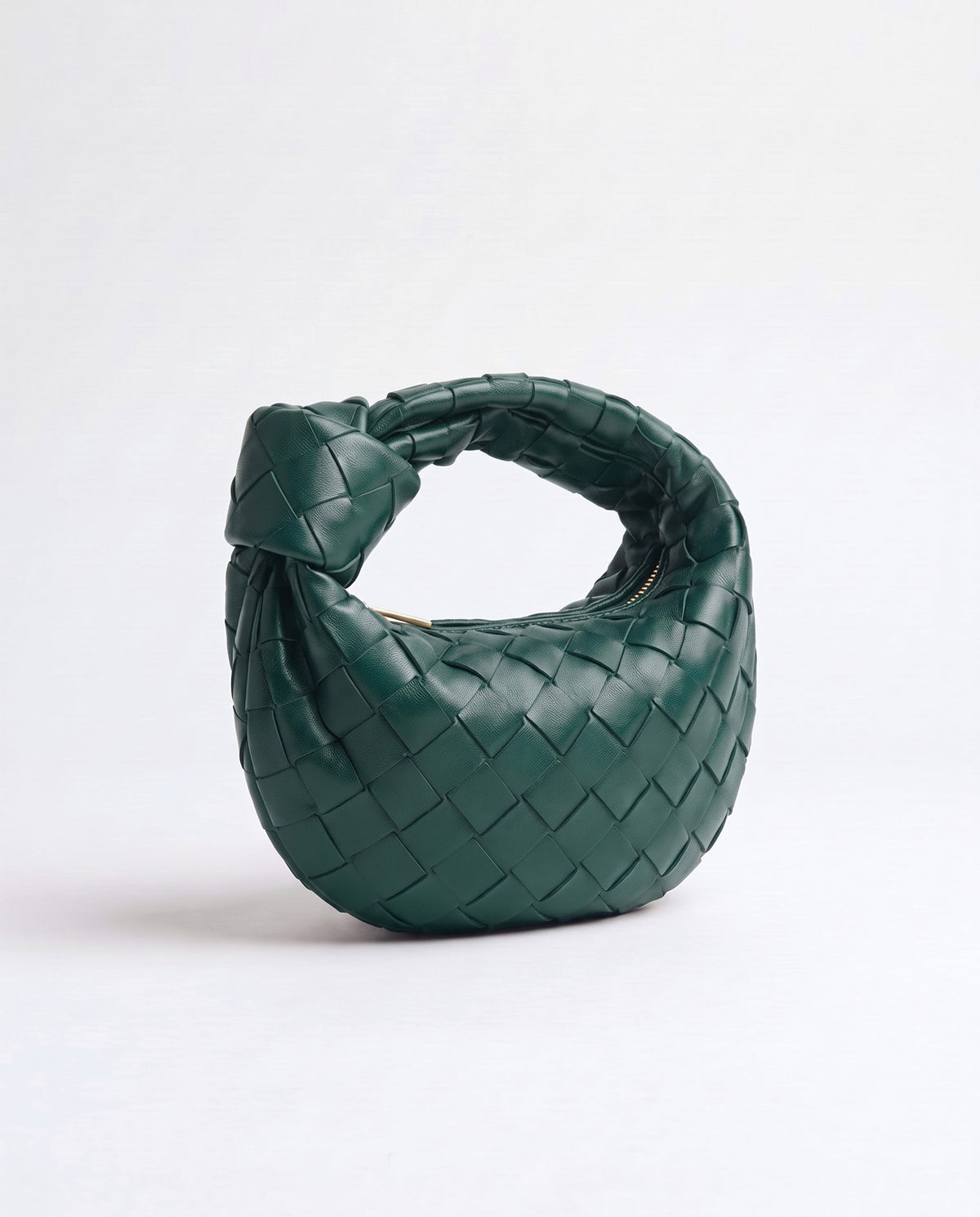 Knot Mini woven leather bag in Emerald – three-quarter view