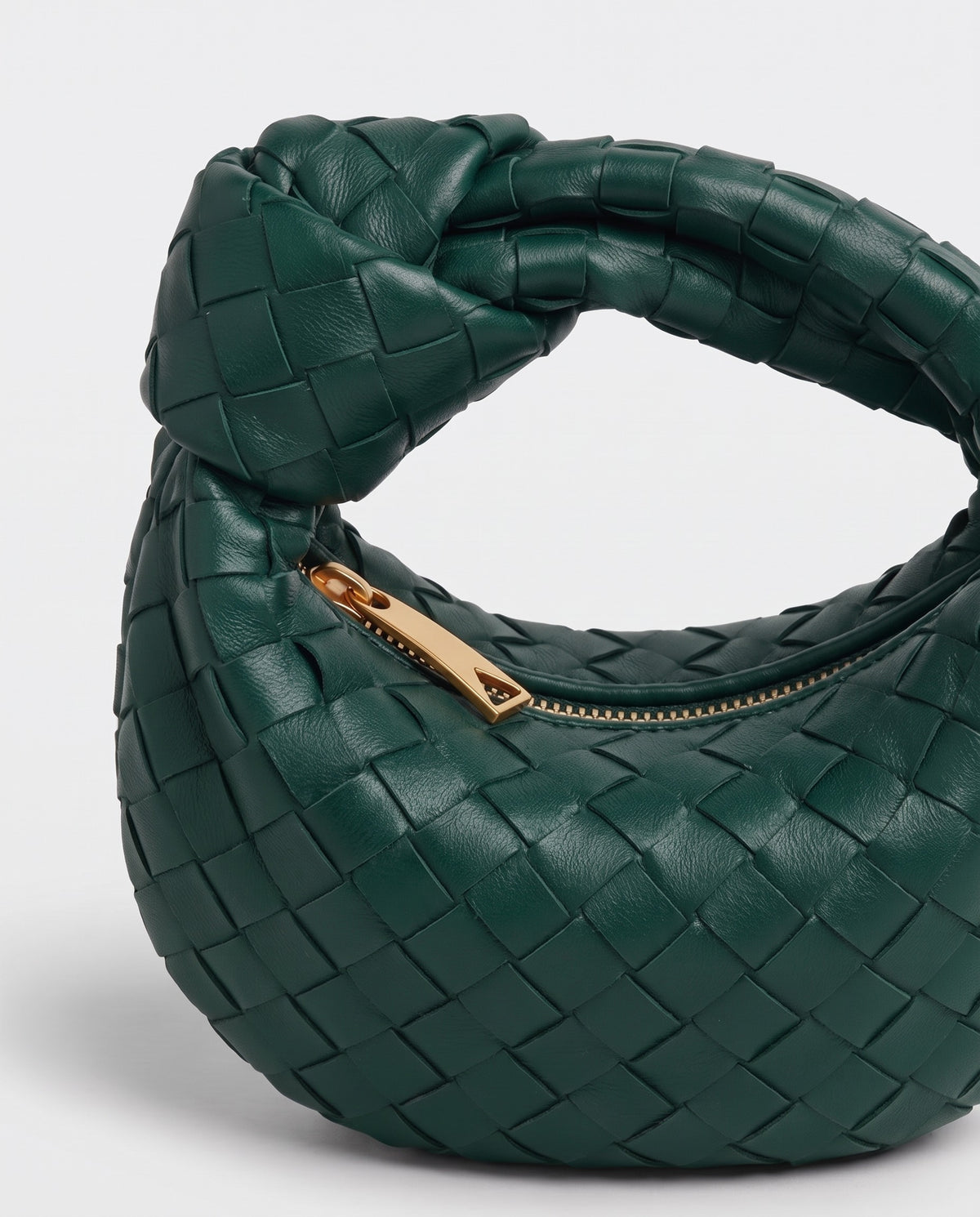 Knot Mini woven leather bag in Emerald – close-up of the knotted handle