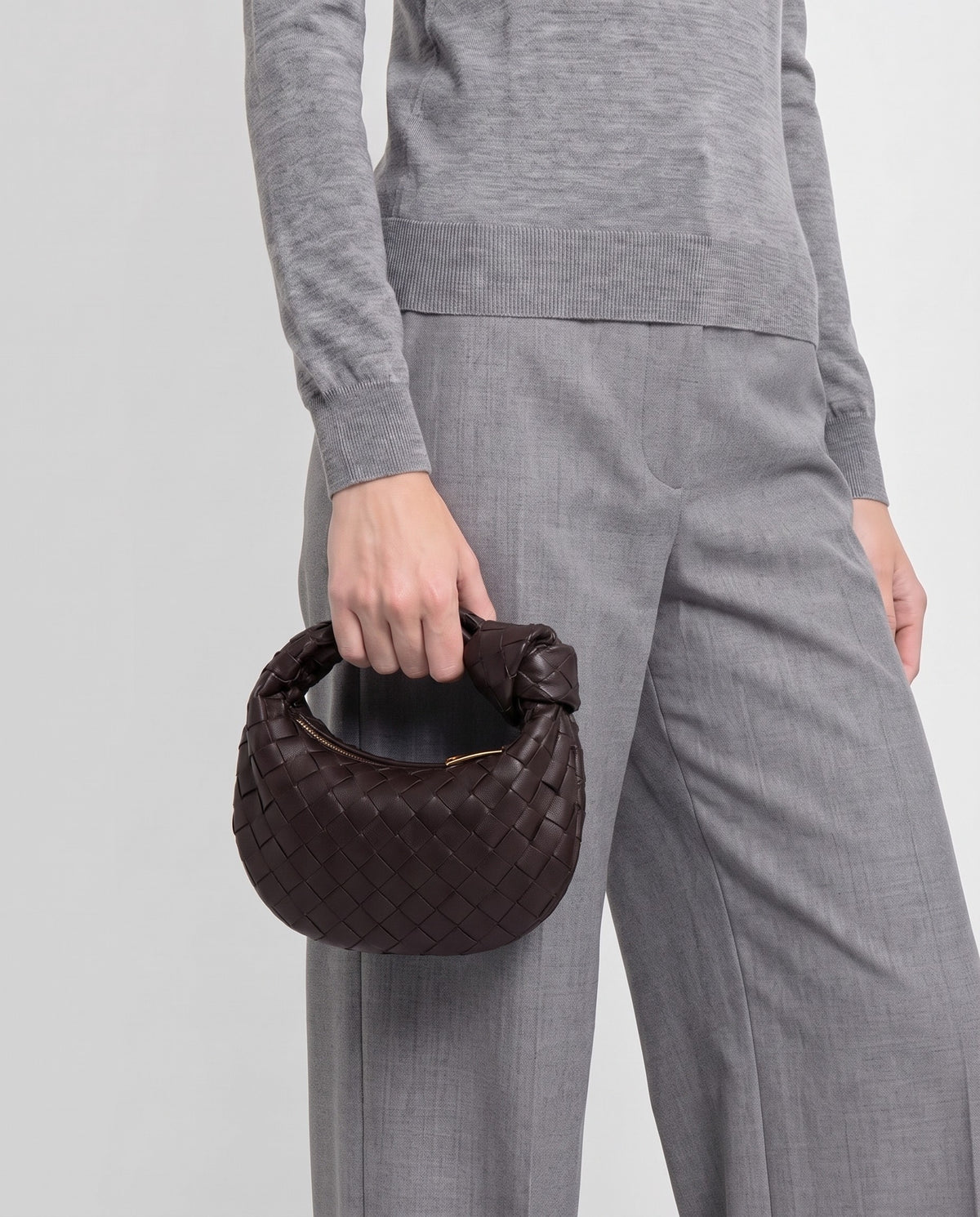 Knot Mini woven leather bag in Espresso – model carrying it