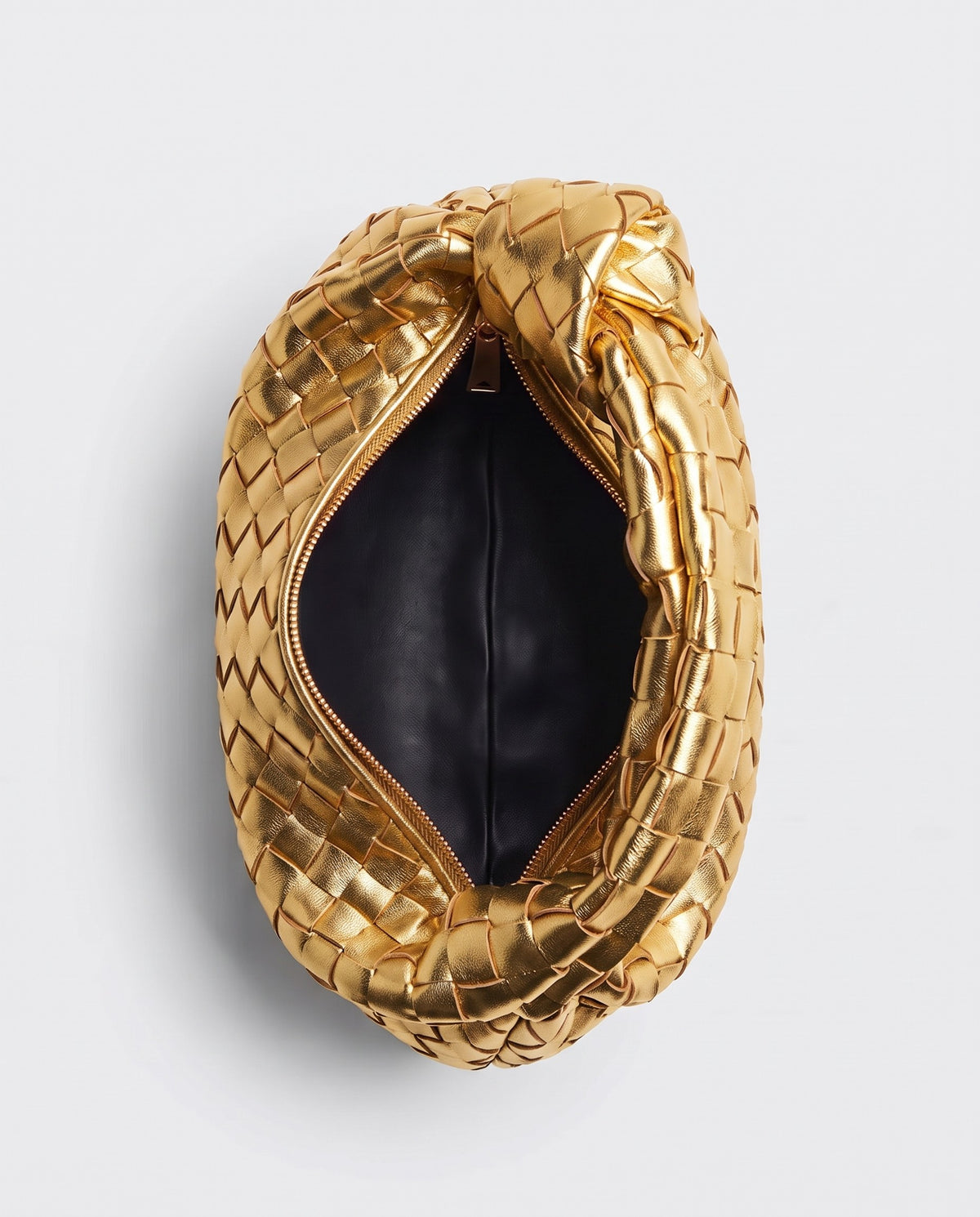 Knot Mini woven leather bag in Gold – inside view with the zip open
