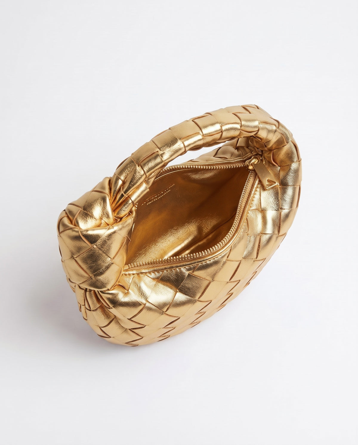 Knot Mini woven leather bag in Gold – inside view with the zip open