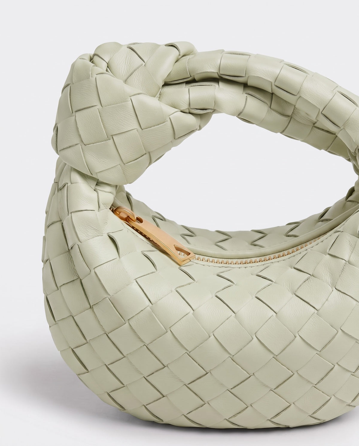 Knot Mini woven leather bag in Pistachio – close-up of the knotted handle