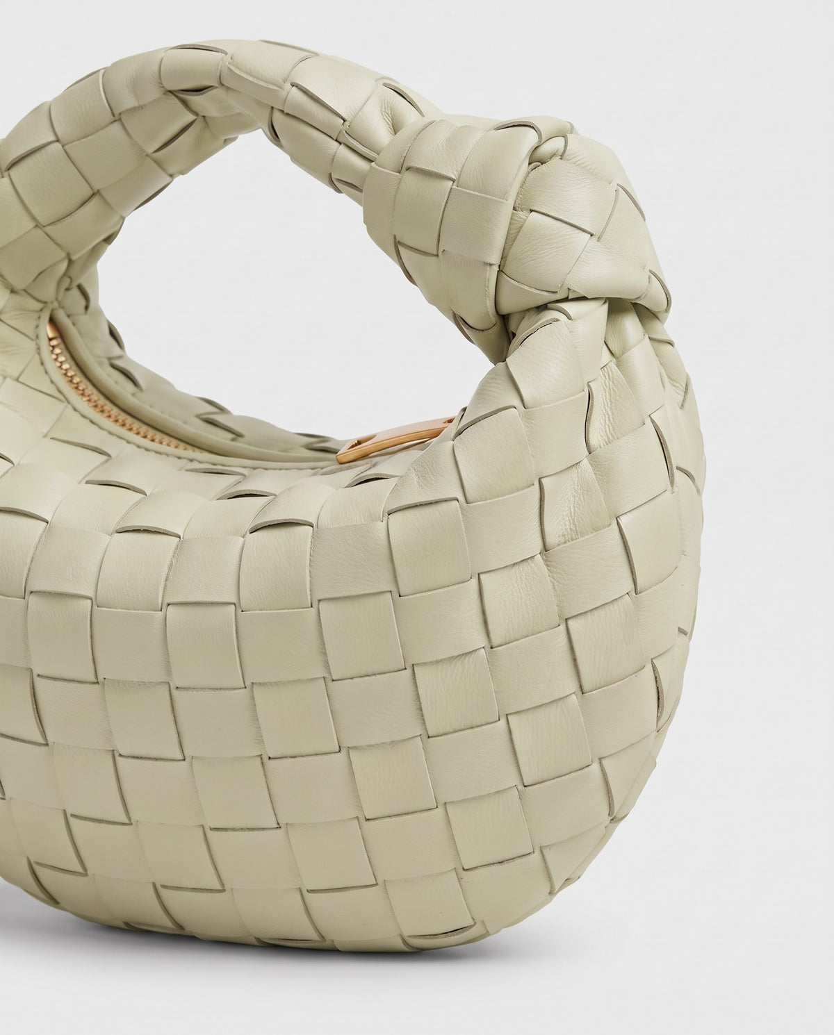 Knot Mini woven leather bag in Pistachio – close-up of the woven leather