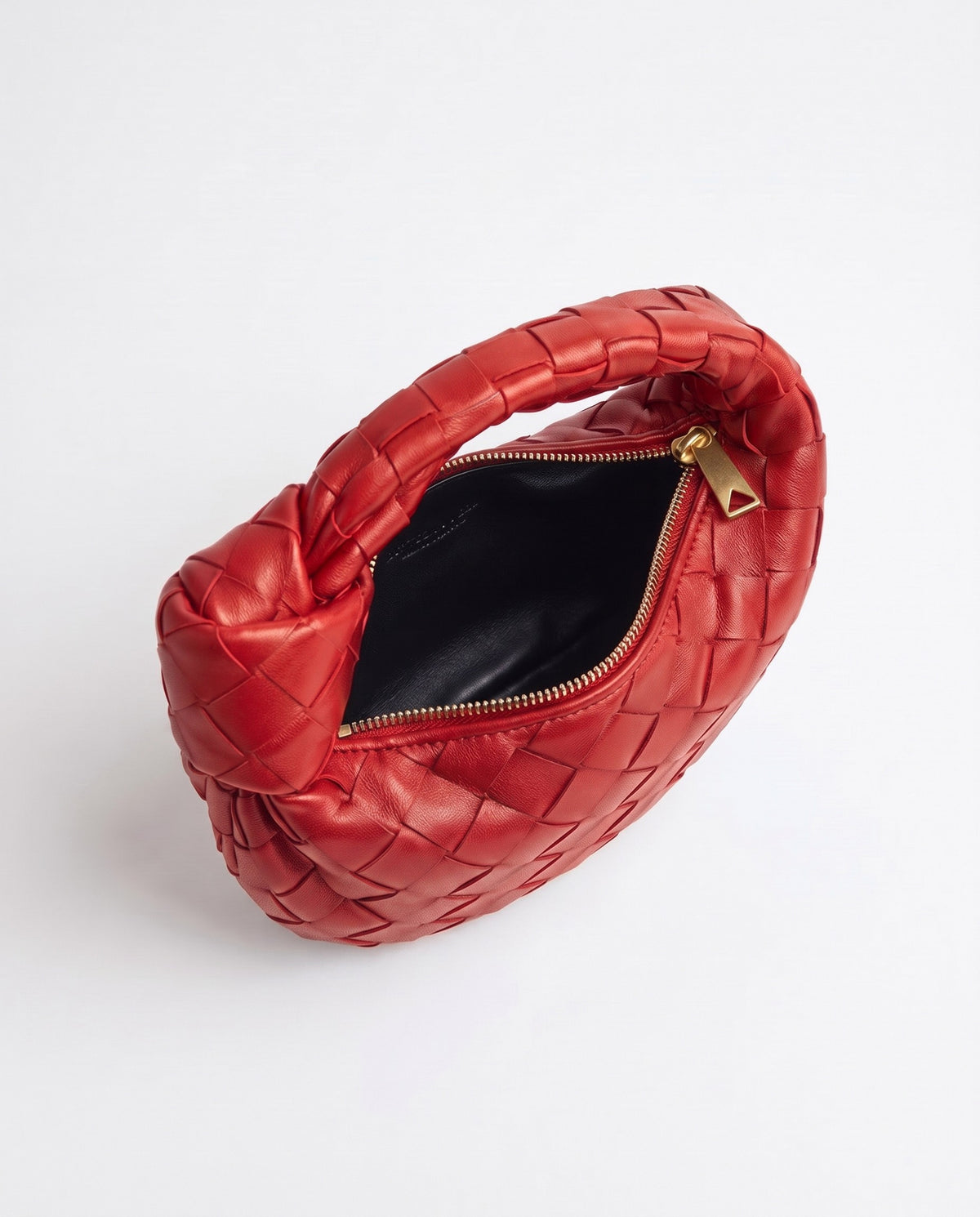 Knot Mini woven leather bag in Scarlet – inside view with the zip open