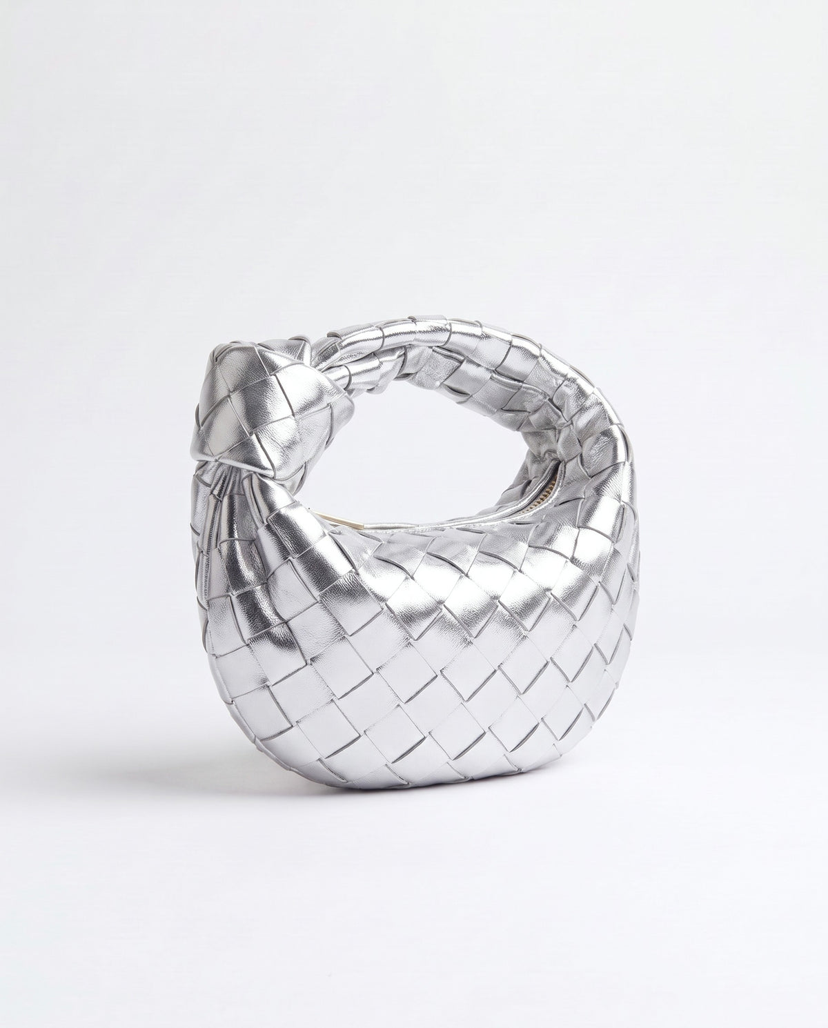 Knot Mini woven leather bag in Silver – three-quarter view