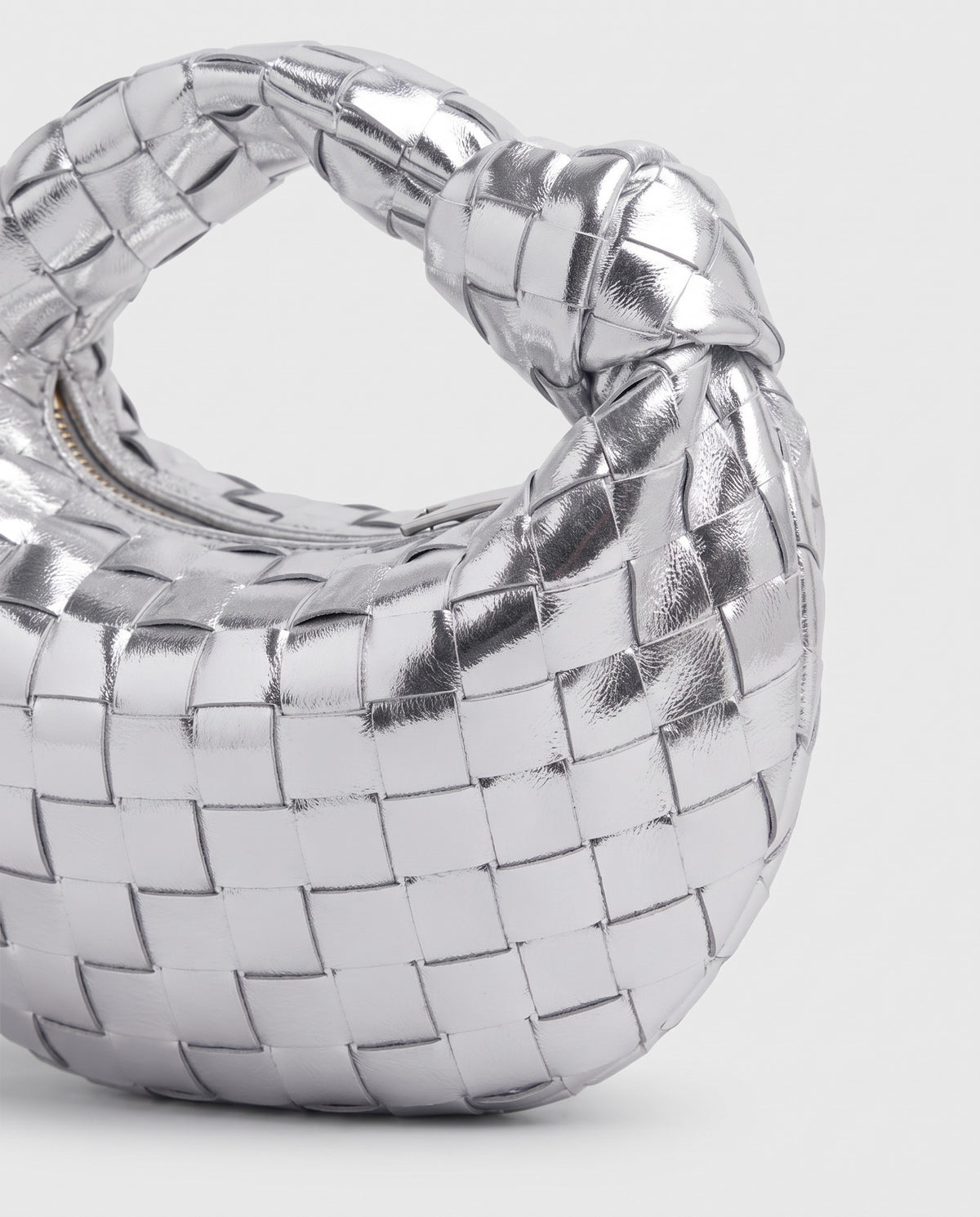 Knot Mini woven leather bag in Silver – close-up of the woven leather