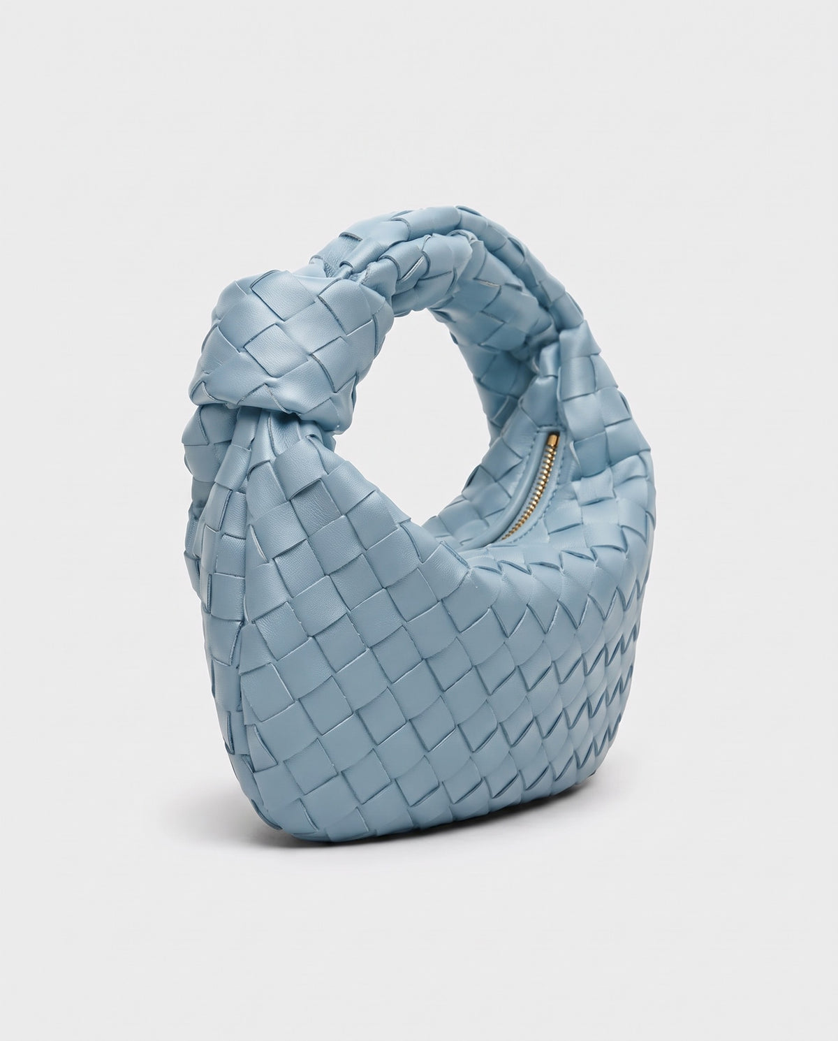 Knot Small woven leather bag in Sky Blue – three-quarter view