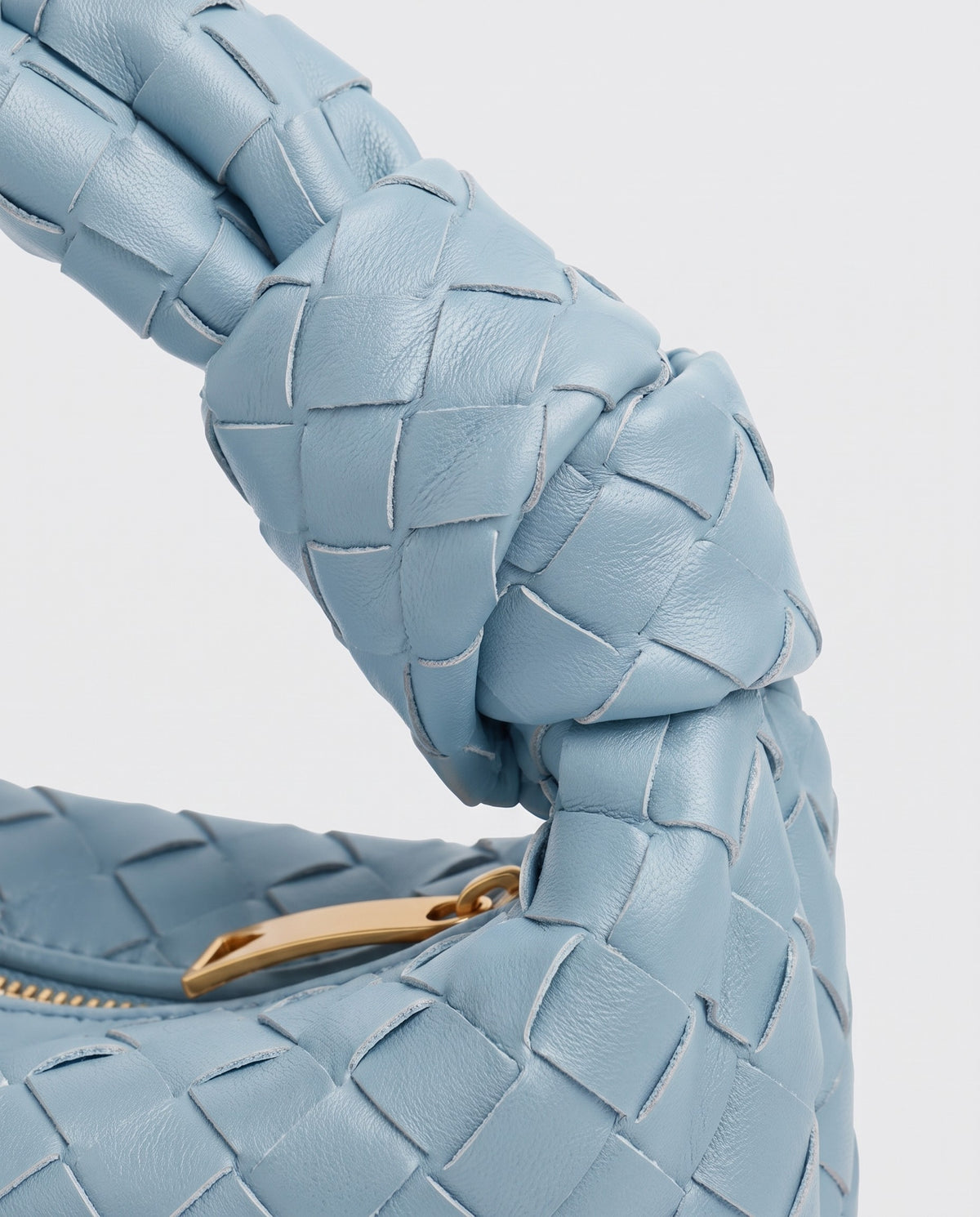 Knot Small woven leather bag in Sky Blue – close-up of the knotted handle