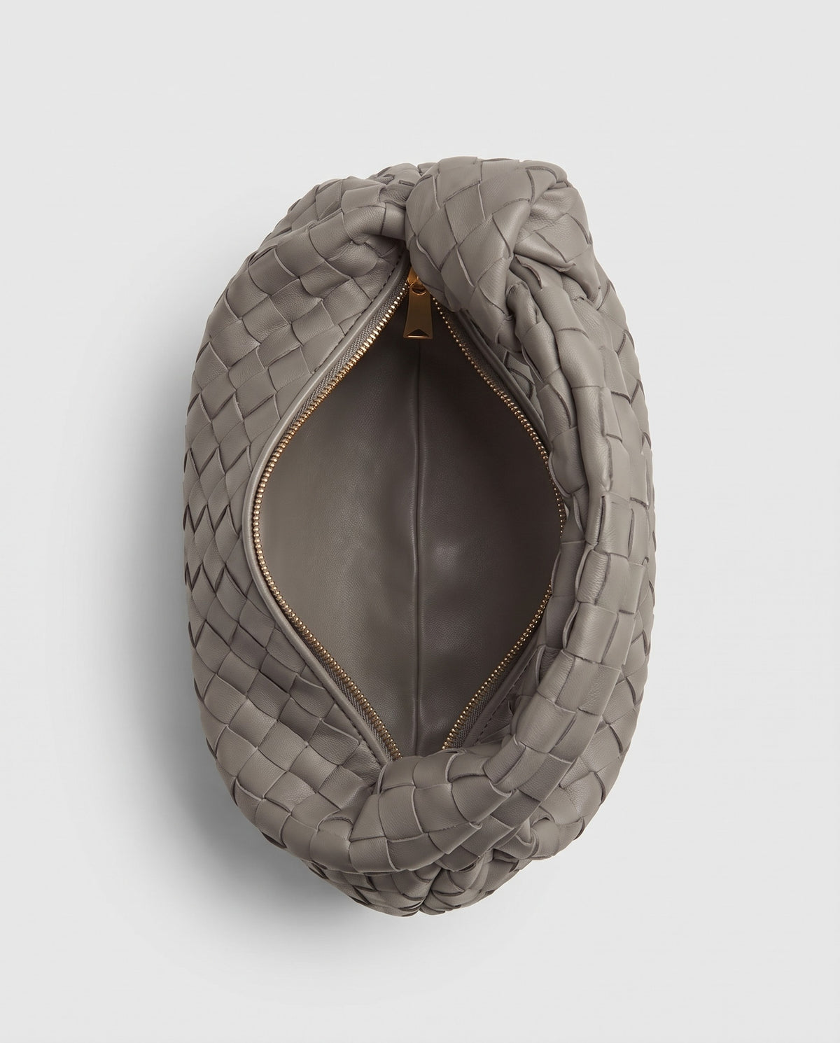 Knot Small woven leather bag in Stone – inside view showing the lining and zip
