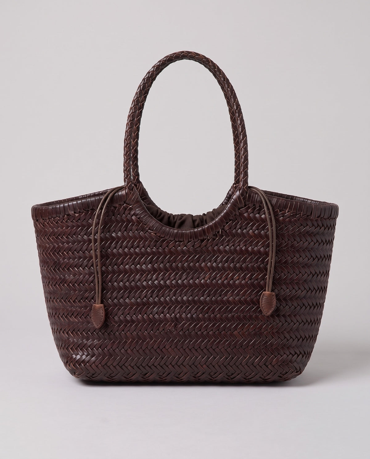 Hardware and handle detail on the Valentina Lecce bag in Chocolate