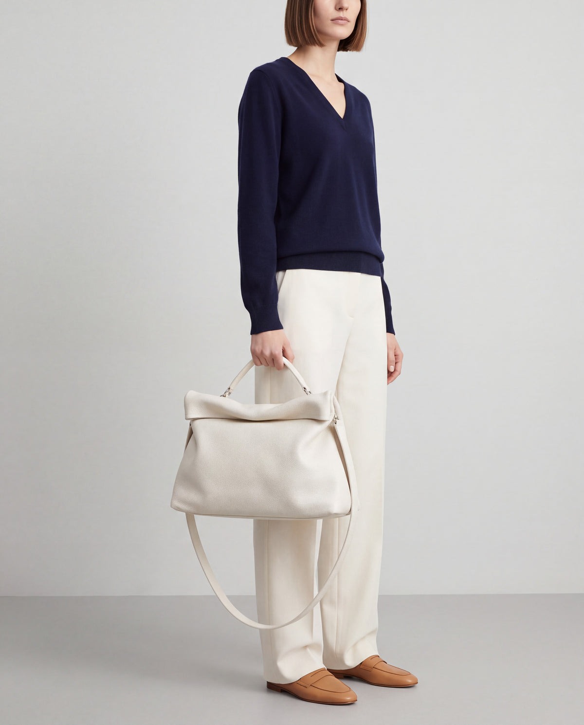 Lido bag in White – worn by model, close-up