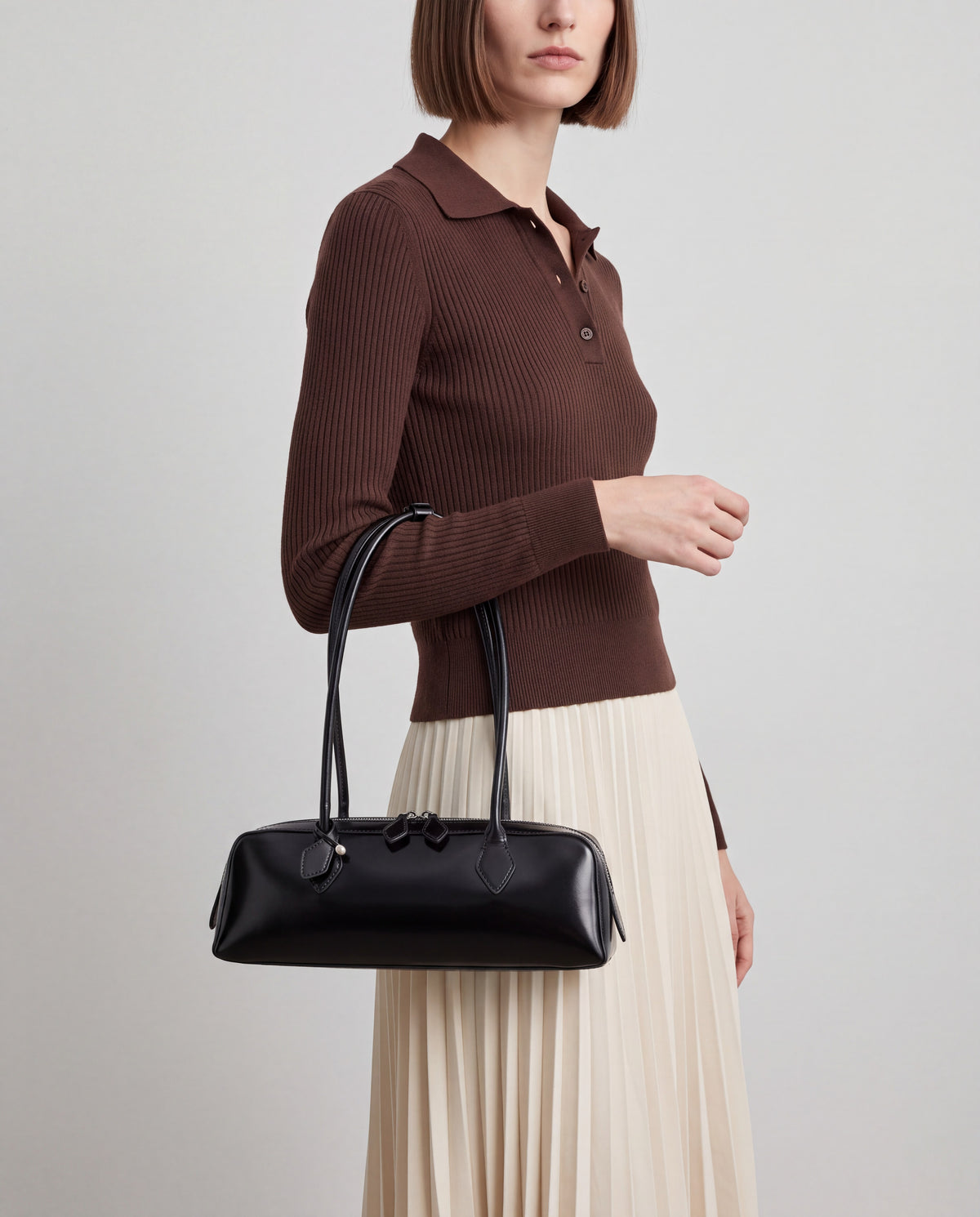 Linda bag in Black – worn by model, close-up