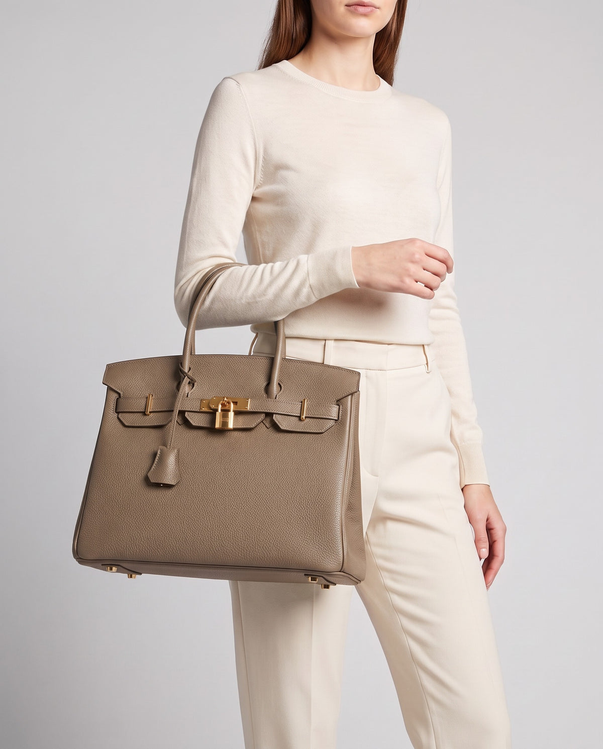 Lock Extra Large leather top-handle bag in Taupe – model carrying it