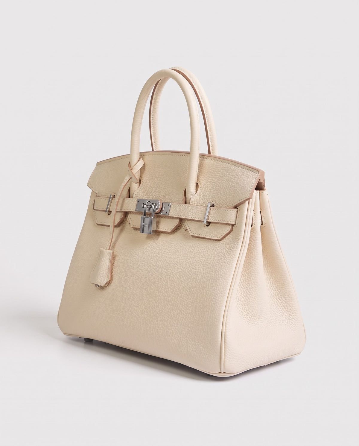Lock Large leather top-handle bag in Cream – three-quarter view