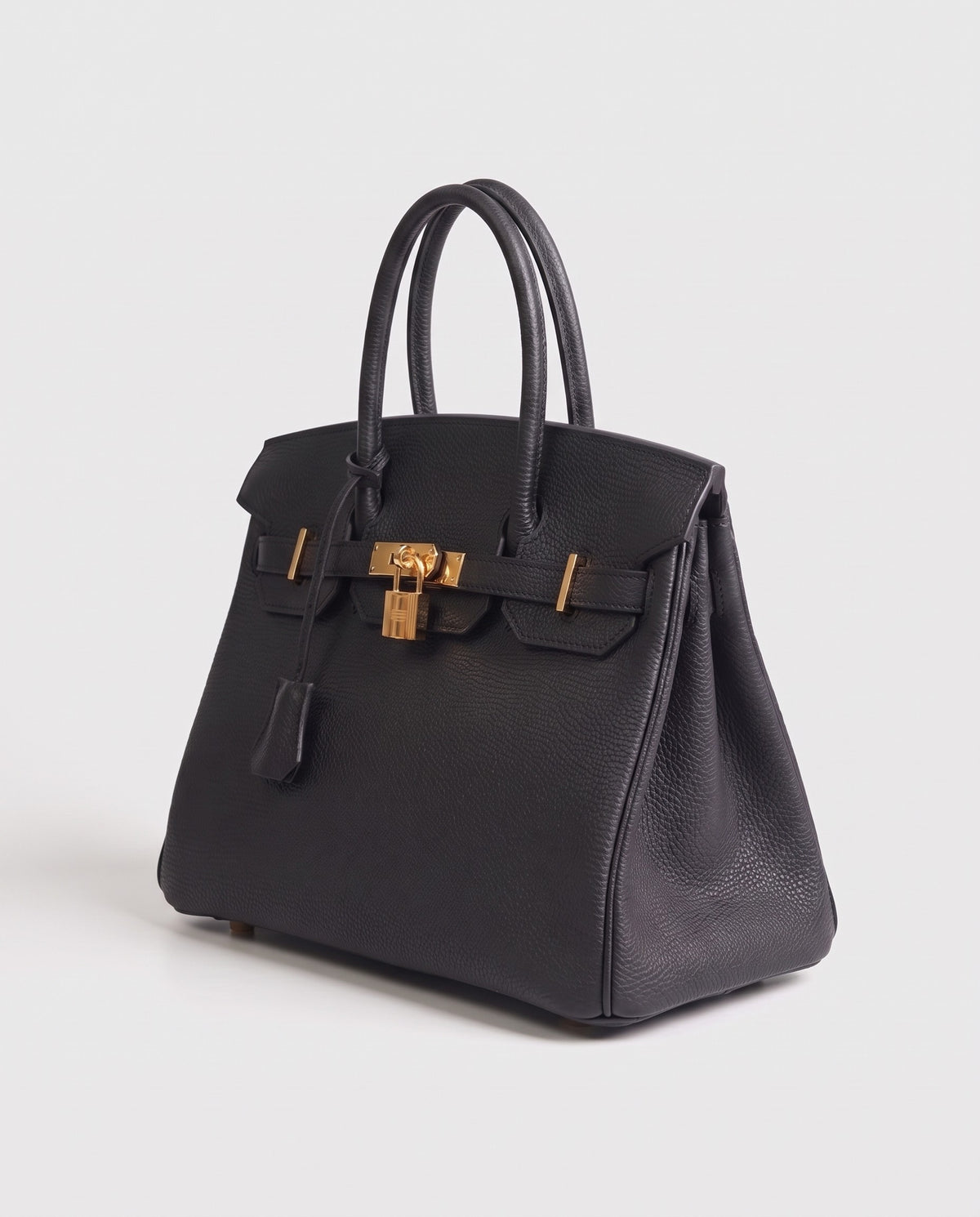 Lock Medium leather top-handle bag in Black – three-quarter view