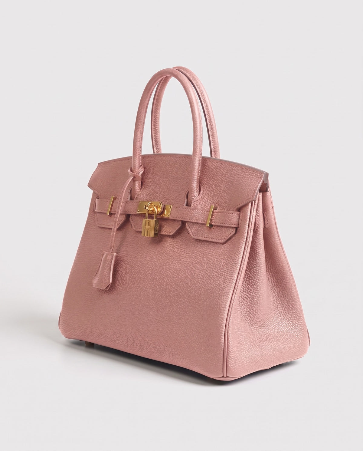 Lock Medium leather top-handle bag in Blush – three-quarter view
