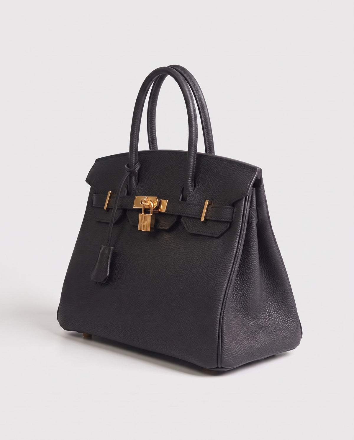 Lock Small leather top-handle bag in Black – three-quarter view