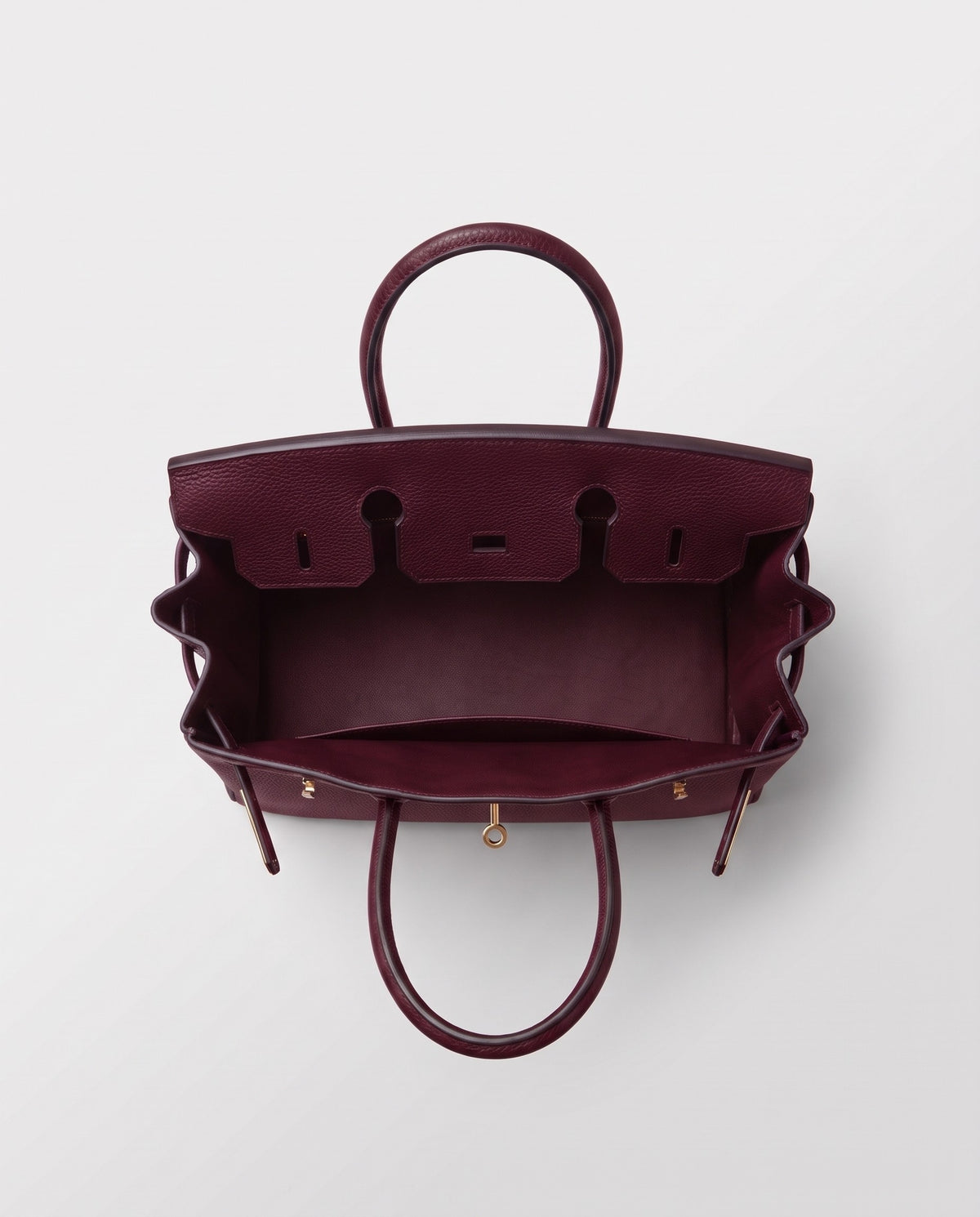 Lock Small leather top-handle bag in Bordeaux – inside view showing the leather lining