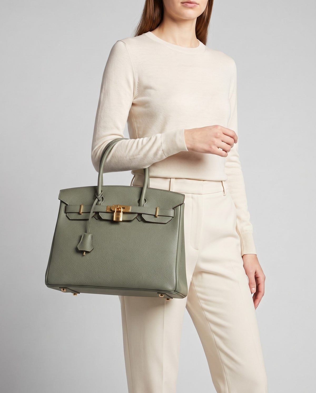 Lock Small leather top-handle bag in Celadon – model carrying it