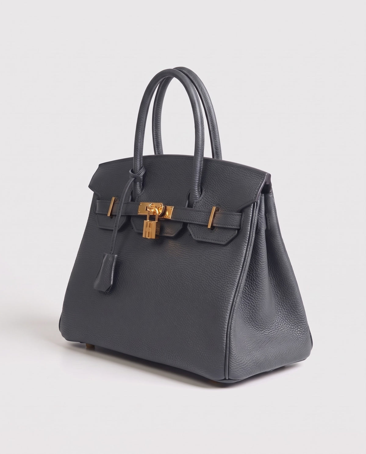Lock Small leather top-handle bag in Charcoal – three-quarter view
