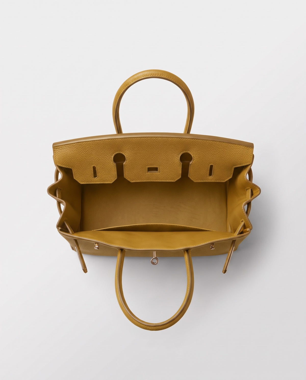 Lock Small leather top-handle bag in Mustard – inside view showing the leather lining
