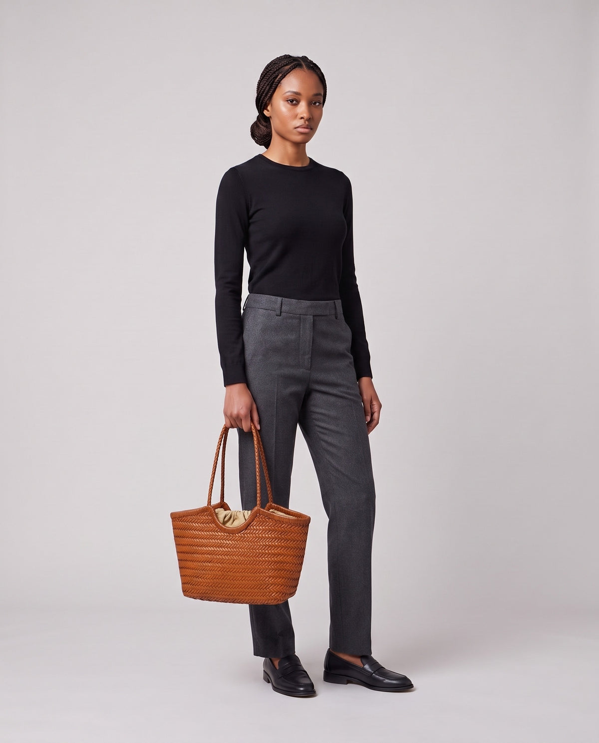 Model holding the Valentina Matera Large bag in Caramel, full length
