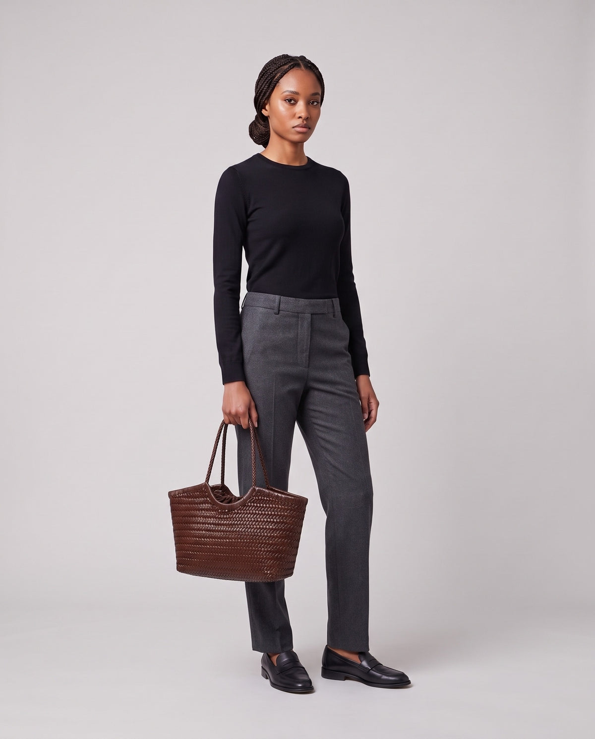 Model holding the Valentina Matera Large bag in Chocolate, full length