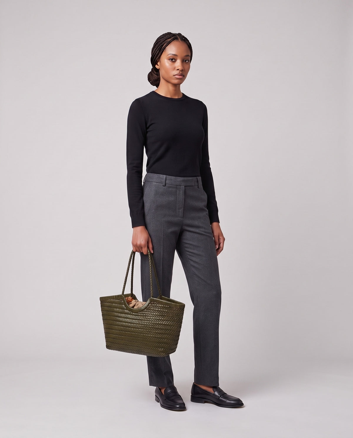 Model holding the Valentina Matera Large bag in Olive, full length