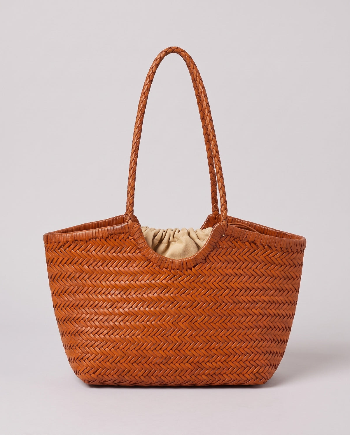 Hardware and handle detail on the Valentina Matera Small bag in Caramel