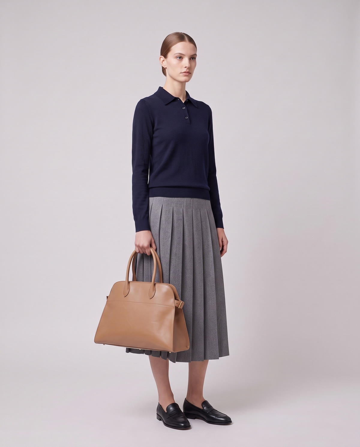 Model carrying the Milano Large bag in Camel leather on her arm