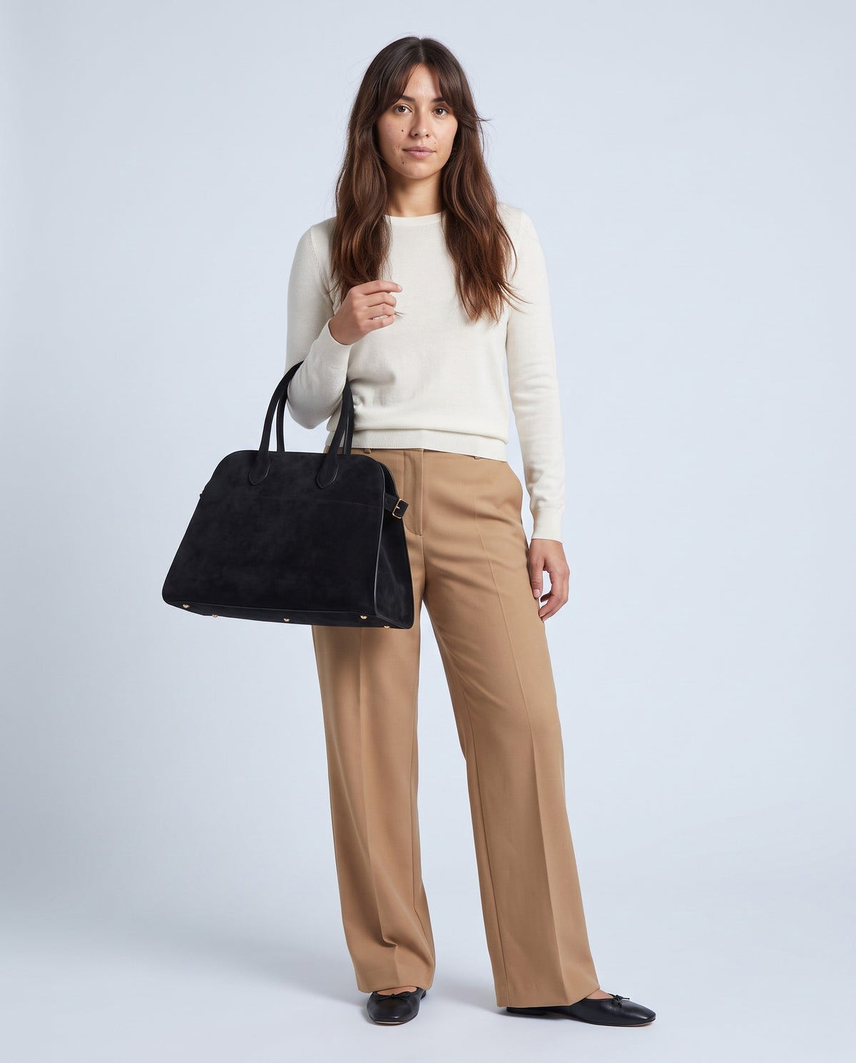 Model carrying the Milano Large bag in Jet black suede – full length
