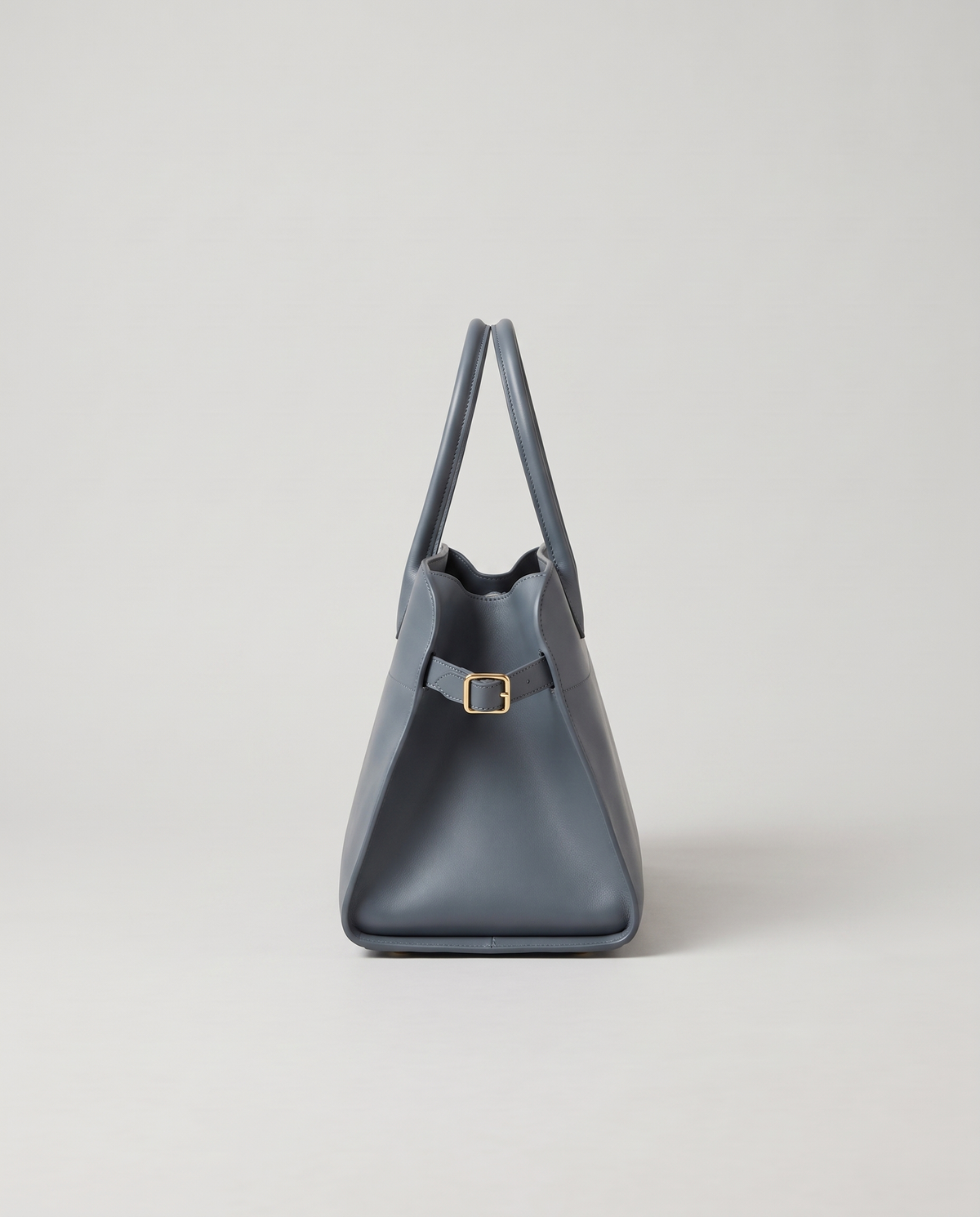 Milano Small top-handle bag in Slate – side view showing the buckled side strap